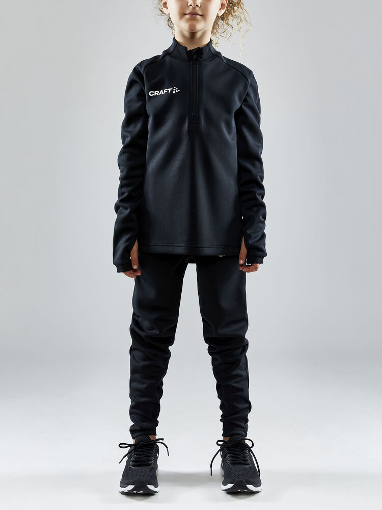 Evolve Halfzip Jr børnetrøje fra Craft, funktionel mellemlagstrøje i genbrugspolyester, til træning og udendørs aktiviteter, farver: Club Cobalt, Navy, Bright Red, Team Green, Juniper, TRUE PURPLE, White, Asphalt, Black.